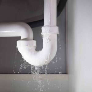 Close-up,Of,Water,Is,Leaking,From,The,White,Sink,Pipe water leaking from a white sink pipe