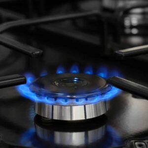 Gas,Blue,Flame.,Gas,Stove,On,Black,Background.,Natural,Gas blue flame on a gas powered stove